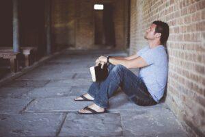 Sad man holding Bible